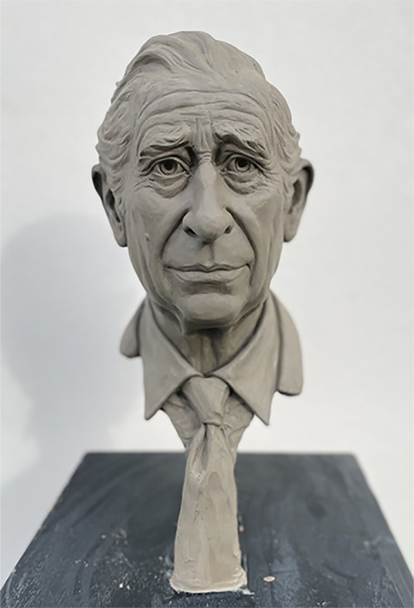 A portrait image of the clay bust of King Charles III. He is sculpted wearing a shirt and tie. The image is featured in the centre of a purple background with pink spots around the sides.