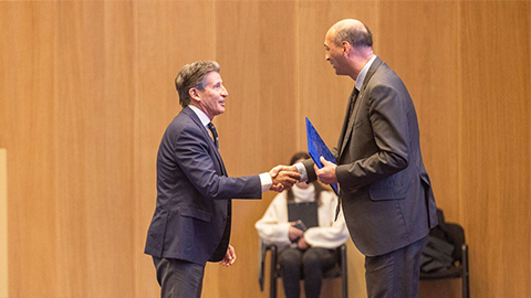 Lord Coe shaking hands with someone