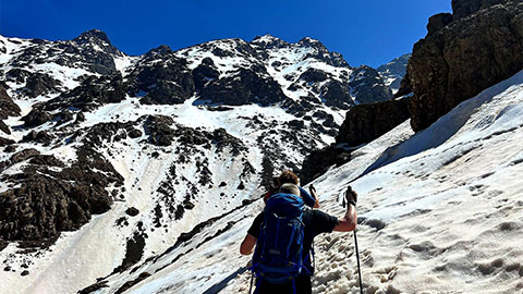 A group of people including Alicia, hiking up Atlas Mountains in Morocco