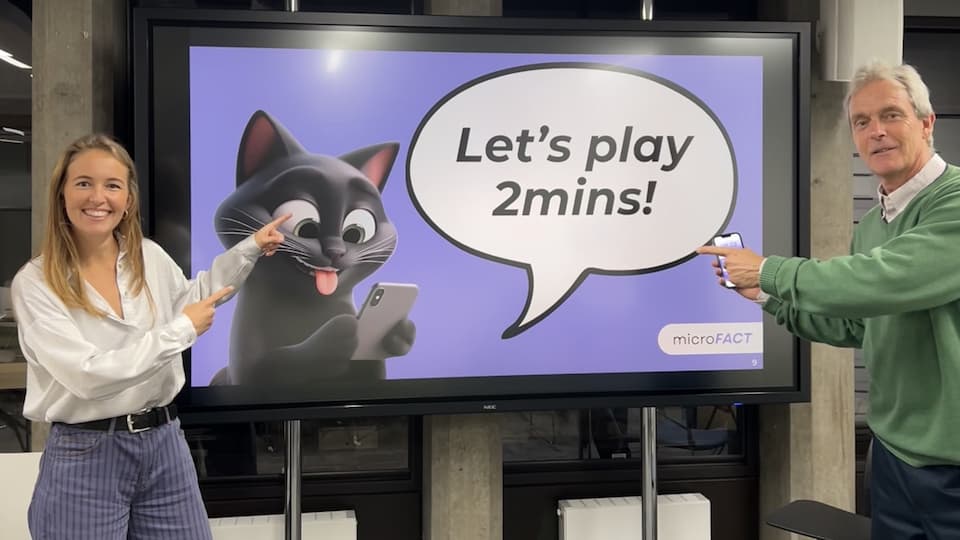 A TV screen with an image on. There is a cartoon cat and a speech bubble, saying 