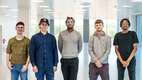 Five people standing