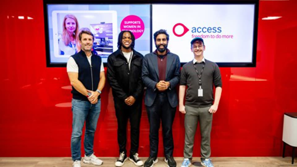 Four people standing together