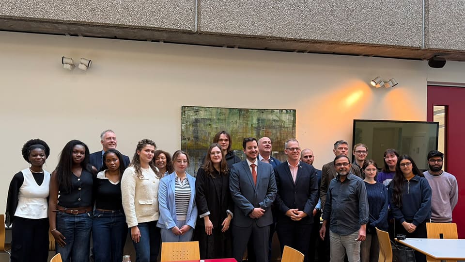 A group of people with Mike Reader MP, centre