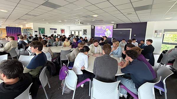 the audience watching a slideshow presentation