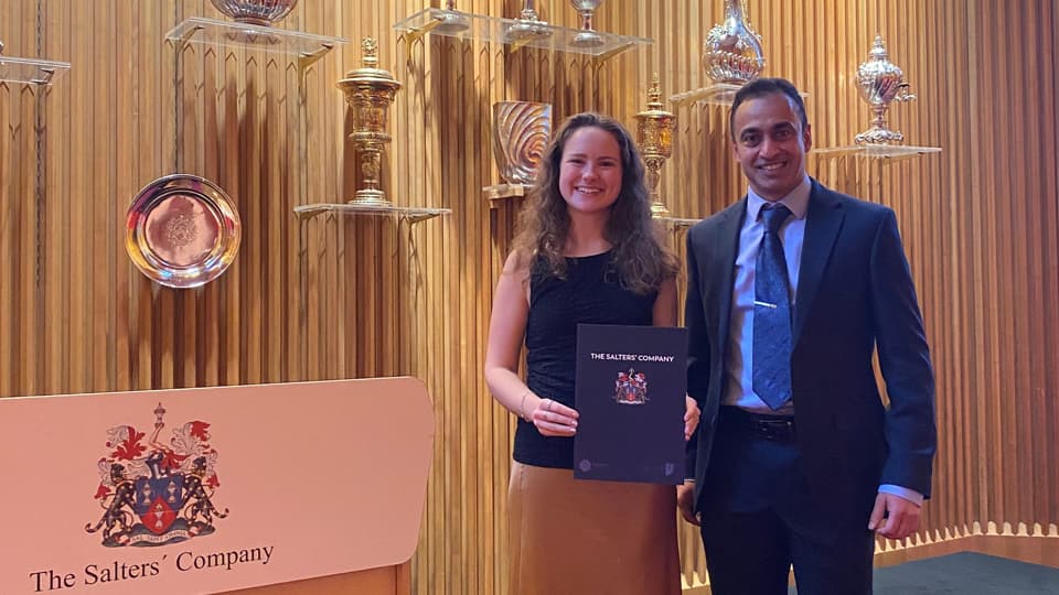 Emily Fitzwater and Dr. Hemaka Bandulasena. Emily holds a certificate.