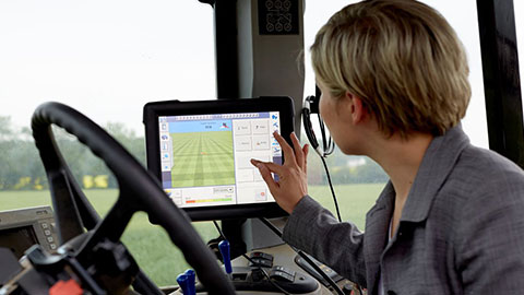 a woman using a computer screen in a cab