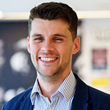 A head and shoulders shot of Cam Bonser against a blurred out background