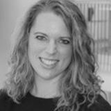 A black and white head and shoulders shot of Pernille Hjort wearing a dark top