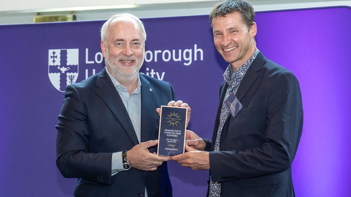 The Dean of Loughborough University London, Tony Edwards, receives a VC Award from Vice-Chancellor, Nick Jennings, on behalf of Deborah Bowen