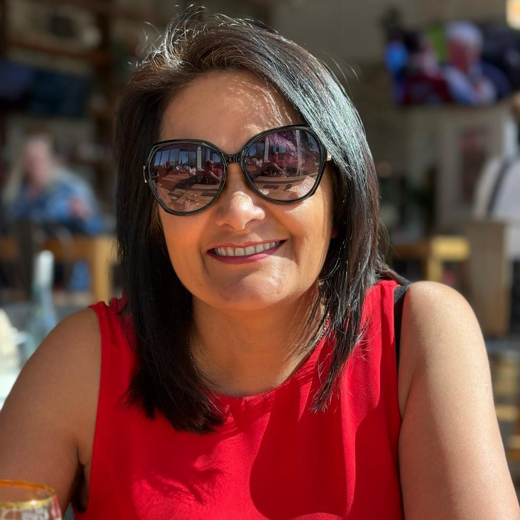 Kokila smiling in sunglasses