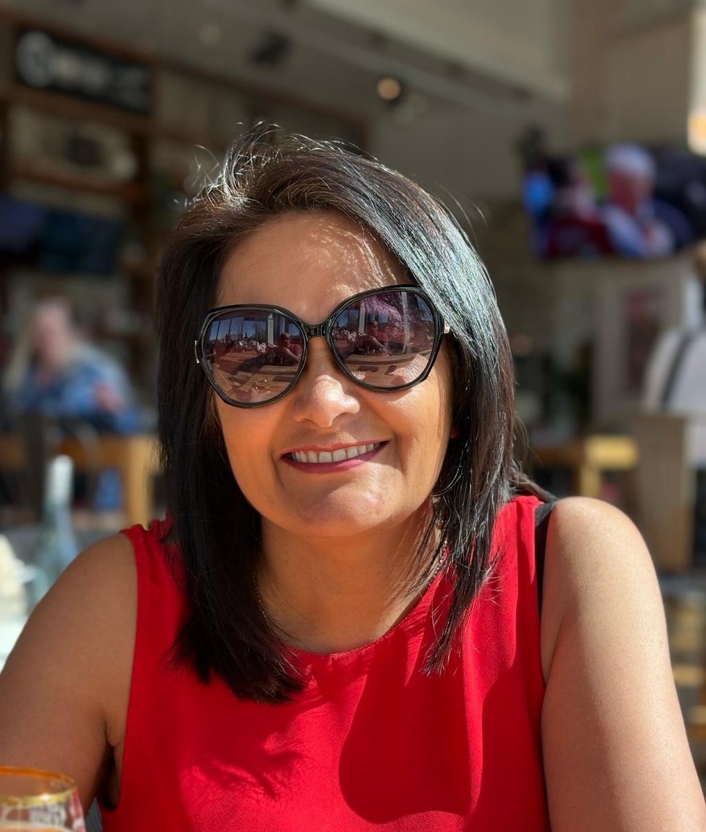 Kokila smiling in sunglasses