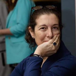 Roberta looking at the camera, chin in hand