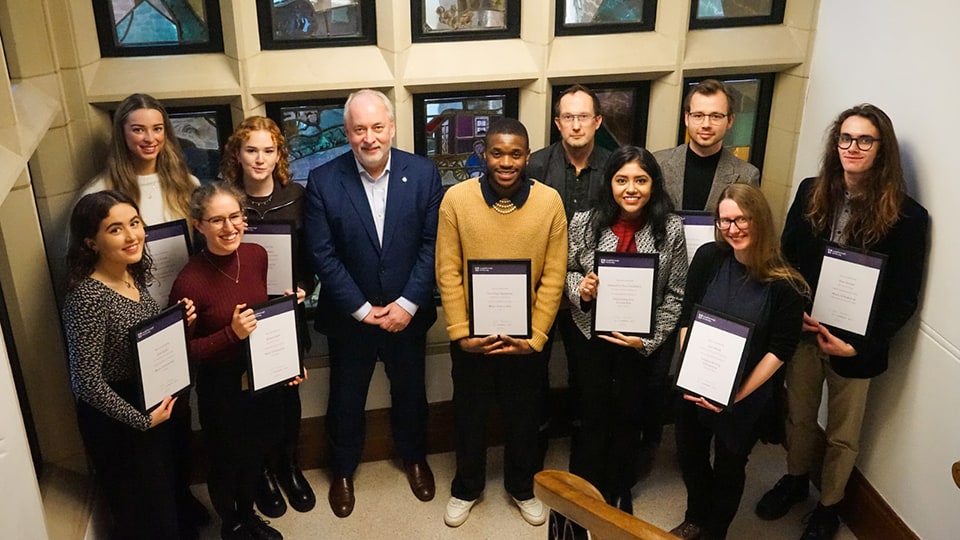 Art students holding award with the Vice-Chancellor and Director of LU Arts
