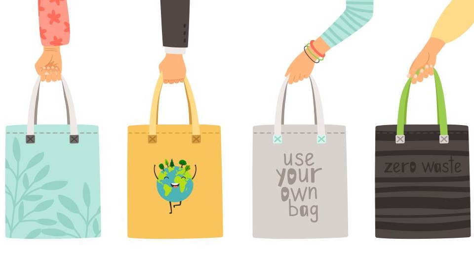 Illustrated graphic showing four different arms hanging down from the top, each holding a tote bag with a different environment themed design.