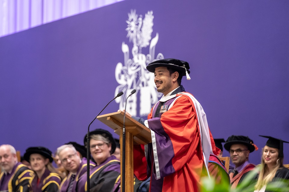 Record-breaking mountaineer Nims Purja is pictured on stage recieving his honorary degree.