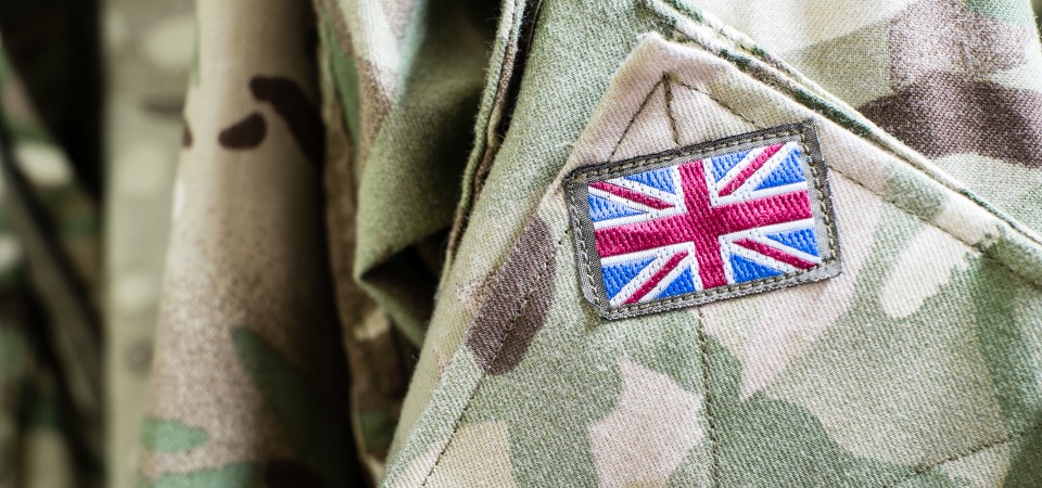 An army uniform with a Union Jack on the sleeve
