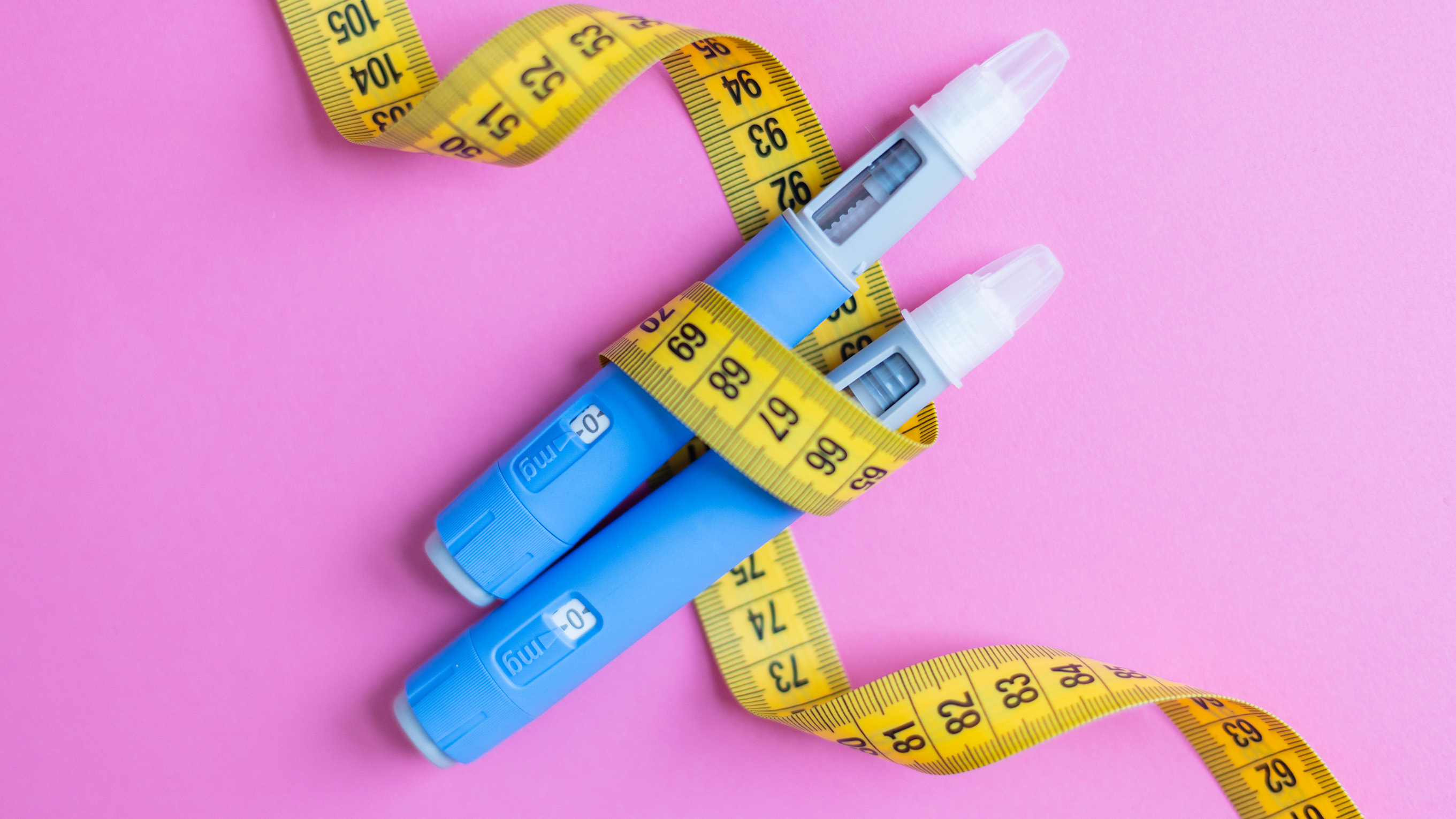 weight loss injections with tape measure wrapped around