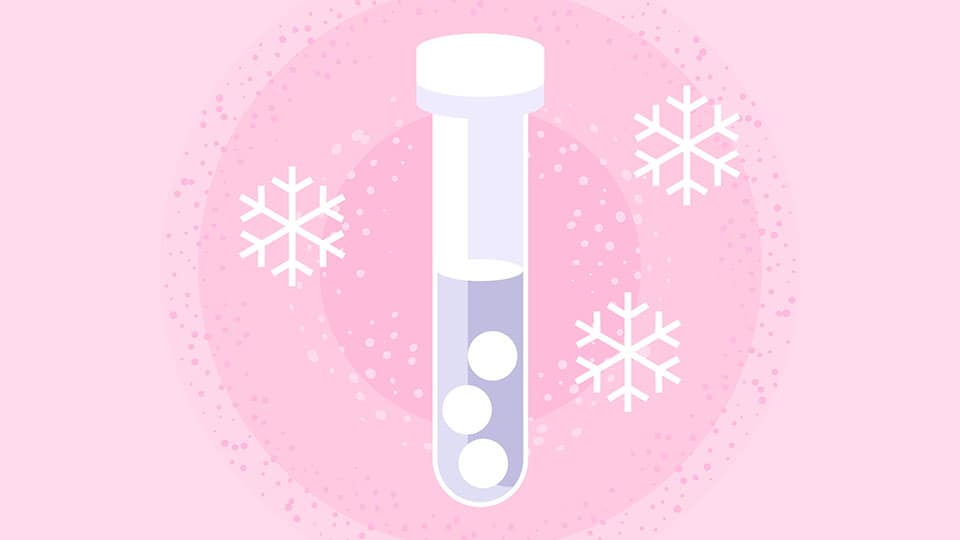 An animated image of a single test tube surrounded by snowflakes to indicate egg freezing