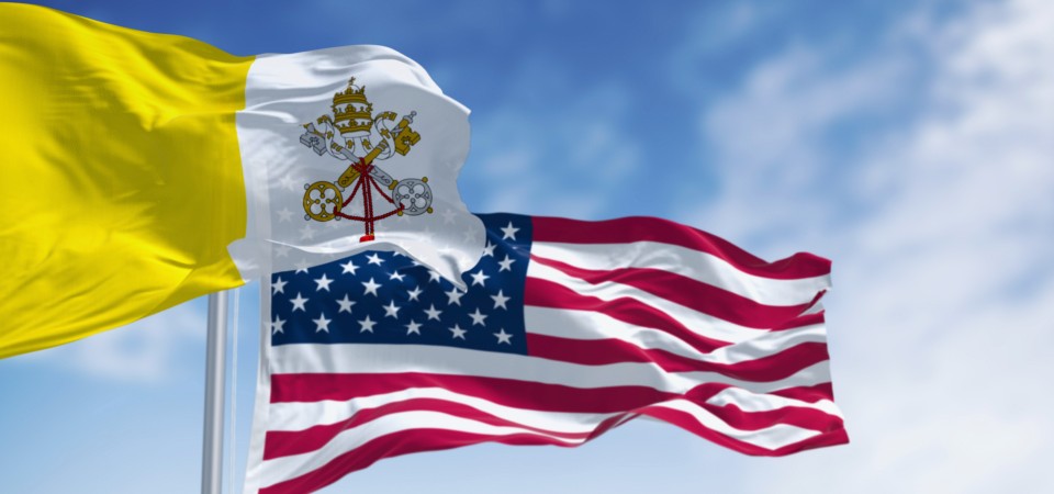 The Vatican flag and the Star and Stripes flying together