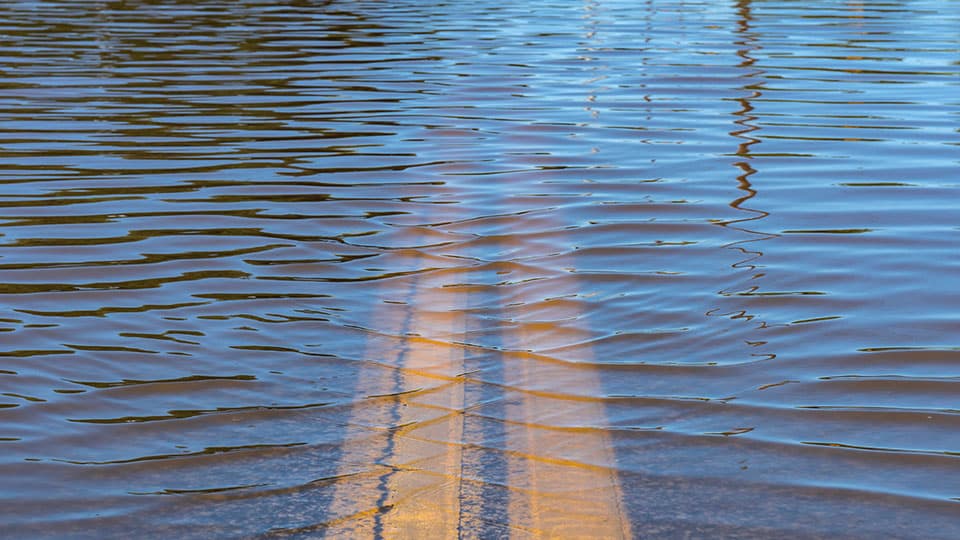 Flood water clearly covering a road