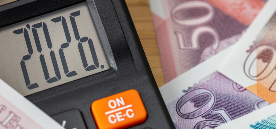 A calculator and british pound notes