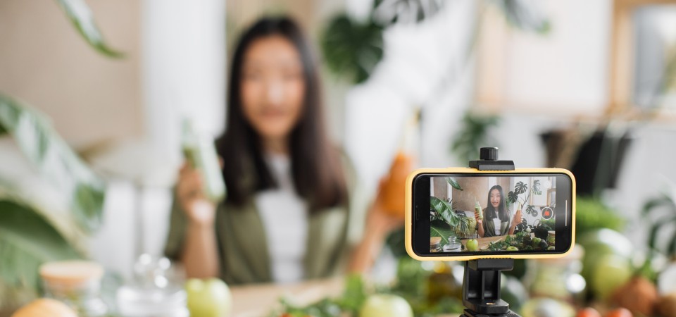 a girl is filming content for her social media channel