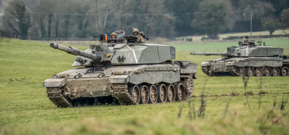 Two tanks in a field.