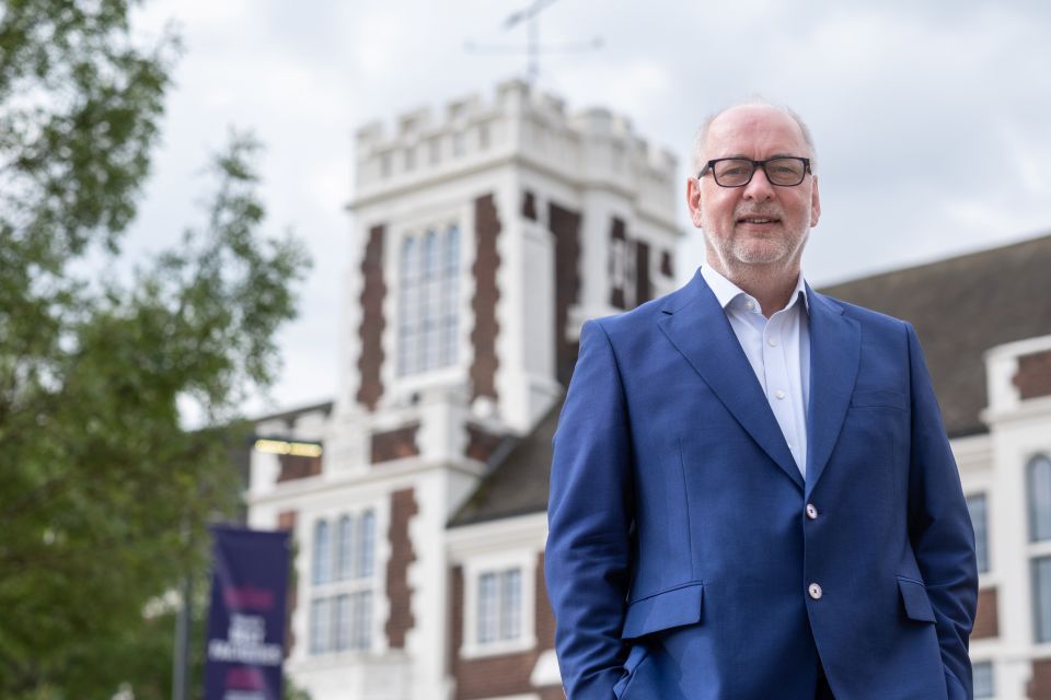 Vice-Chancellor Professor Nick Jennings stood in front of the University's Hazlerigg Building