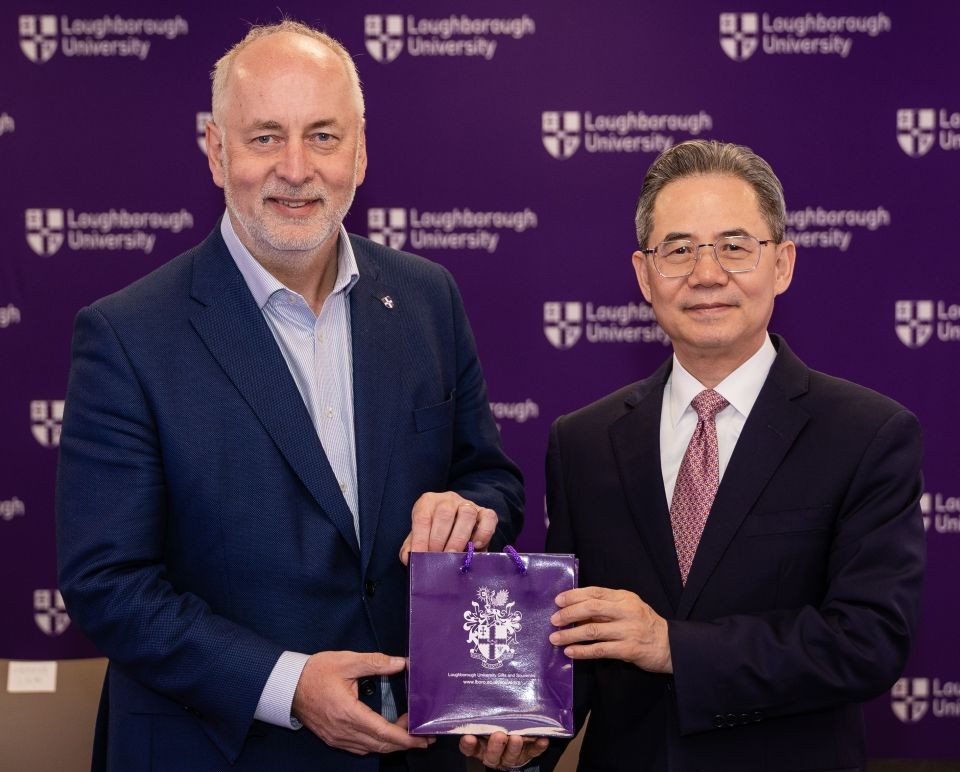 Vice-Chancellor Professor Nick Jennings is stood with the Chinese Ambassador to the UK, Zheng Zeguang, presenting him with a gift