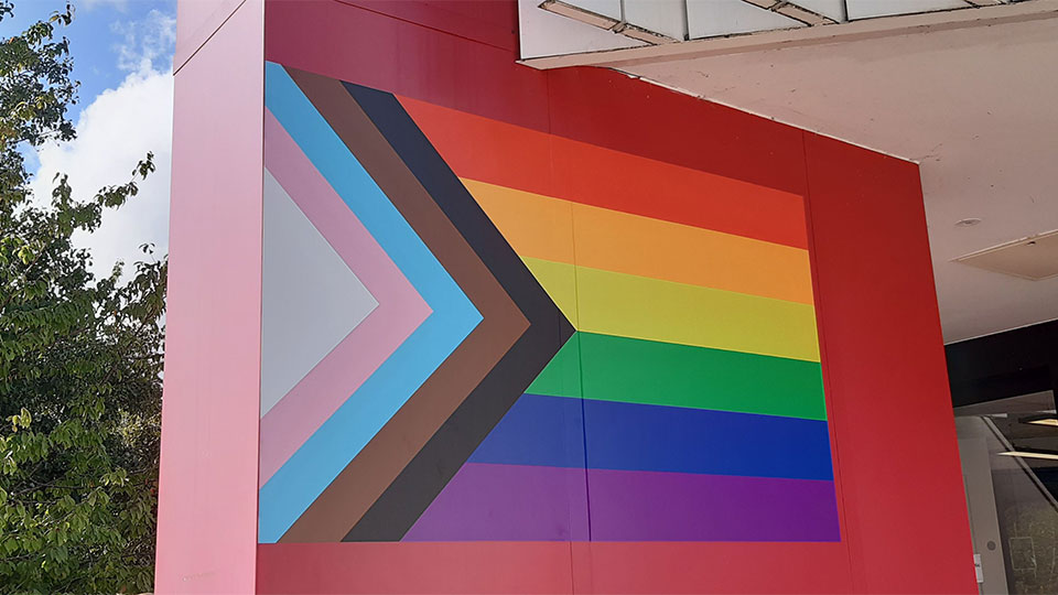 Progress Pride flag on Library Entrance