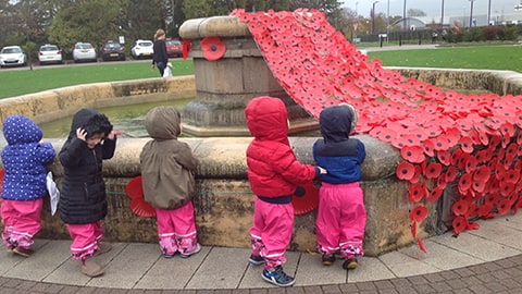 Children attending Rememberance Service at the Fountain on Loughborough University campus