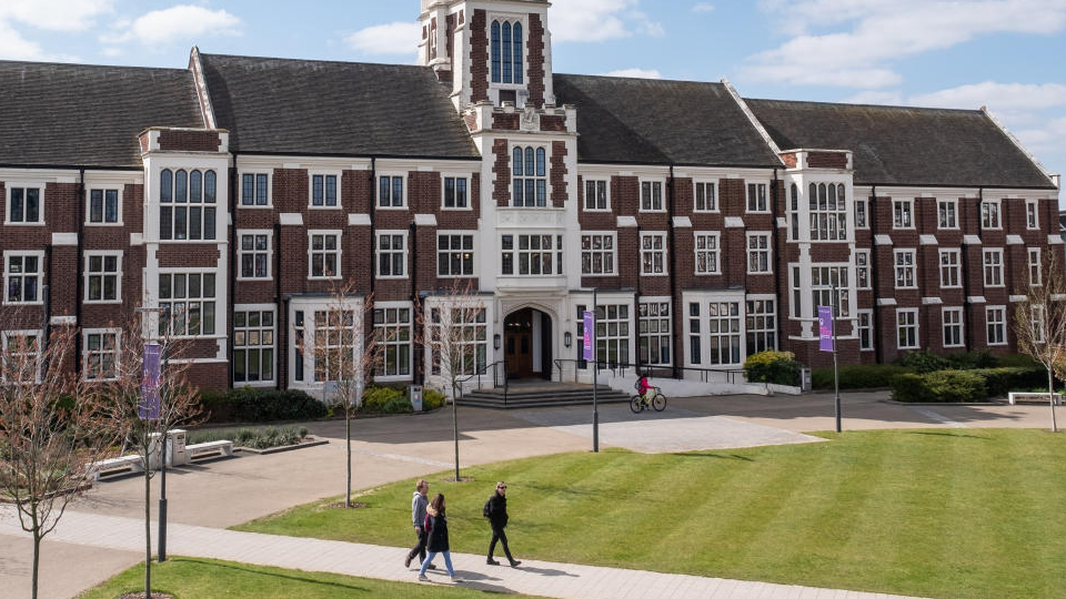 Hazlerigg Building with people walking in front