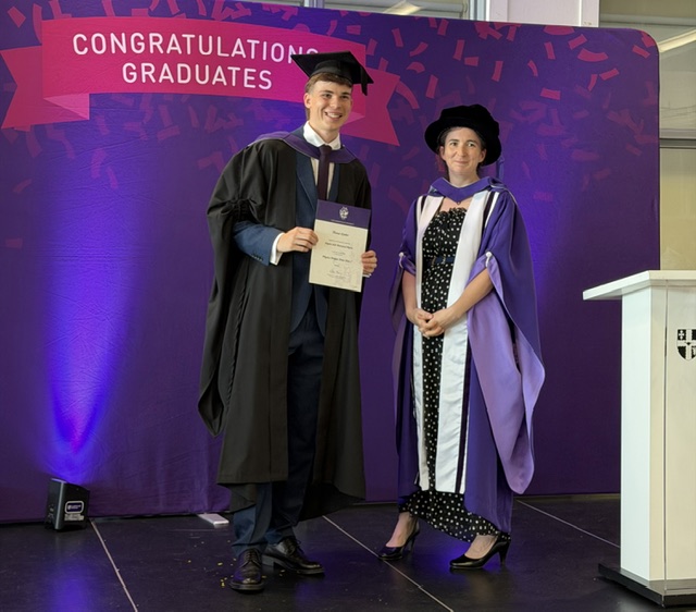 Tom receiving the award