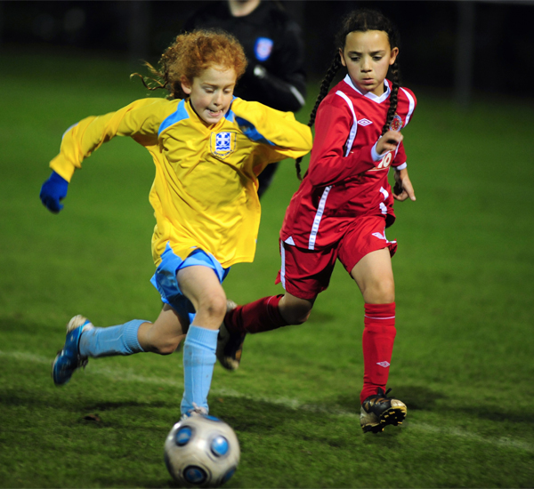 children playing football