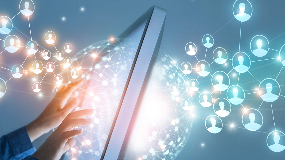 CGI image of a network growing from a computer screen