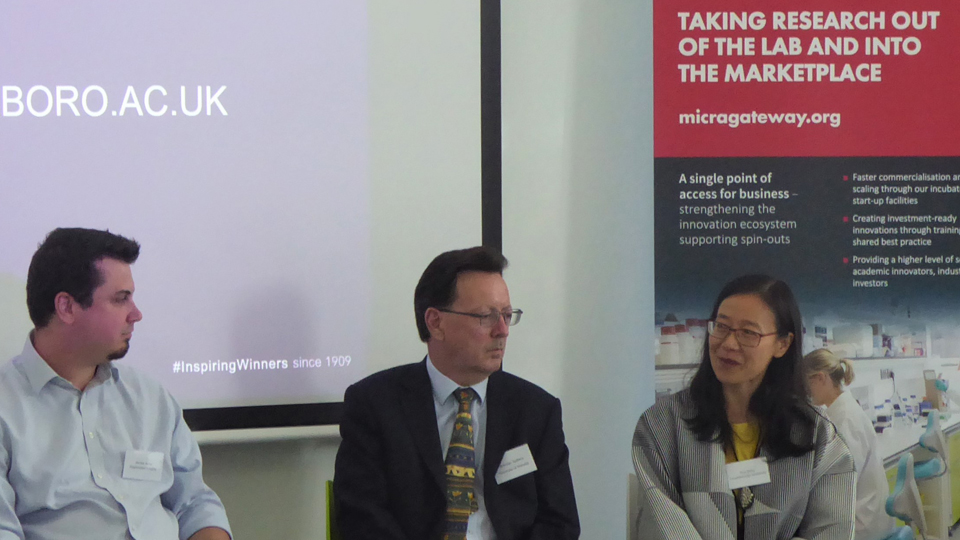 Photograph of Professor Hua Dong - taken during a panel discussion