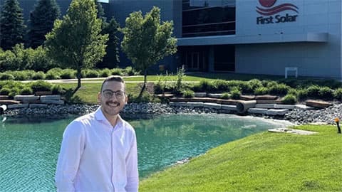 Zeyad Elsayed in front of First Solar building