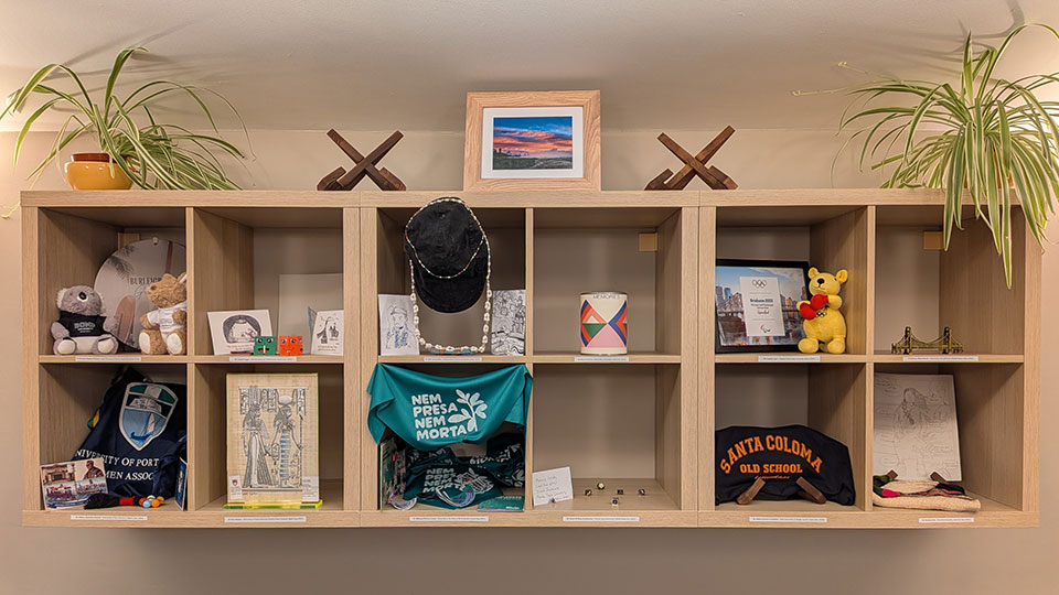 A shelving unit with various arefacts on it