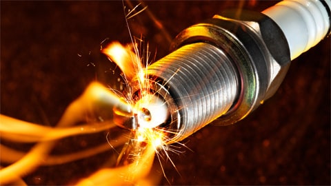 Spark plug igniting fuel