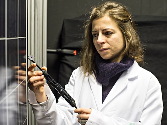 Woman working with photovoltaic systems