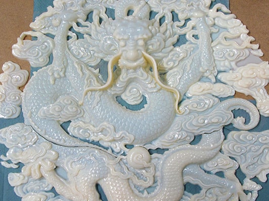 3D-printed model of dragon relief replica prior to painting