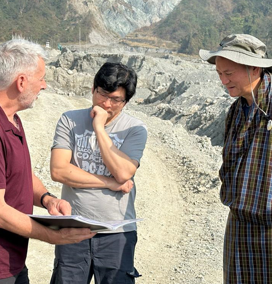 Professor Qiuhua Liang with colleagues during field work