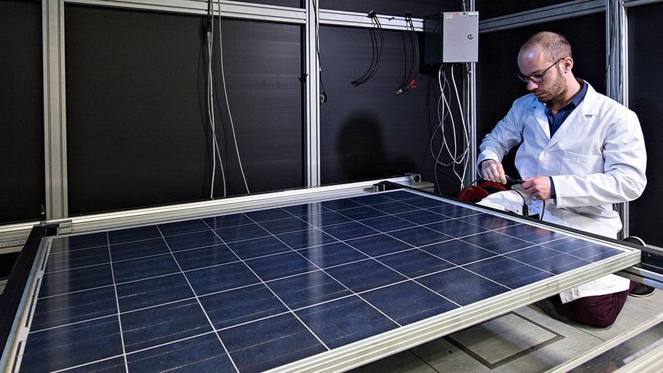 Man working on solar panel