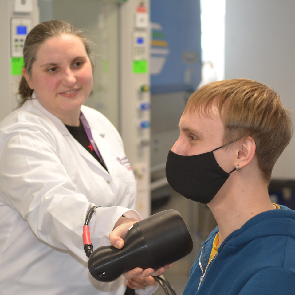 Photograph of Dr Bugby demonstrating the capabilities of the Hybrid Gamma Camera