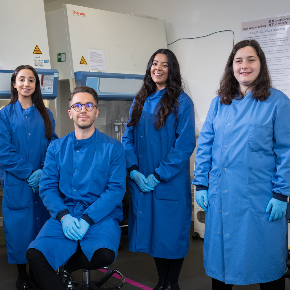 Owen and his team in the lab