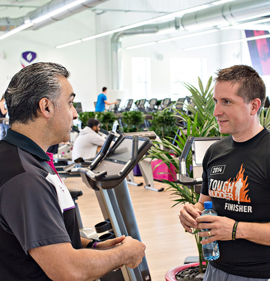 One of the campus gyms - with an instructor and client in the foreground