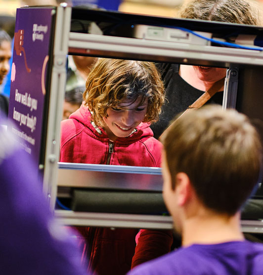 A young visitor to the exhibition introduced to MIRAGE