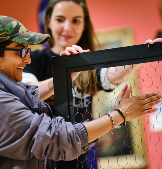 A visitor to the exhibition explores one of the mind-body illusions