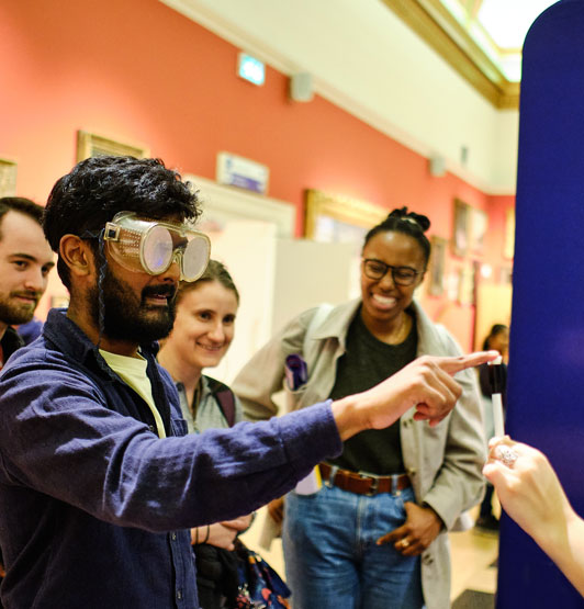 Visitors to the exhibition, exploring one of the mind-body illusions