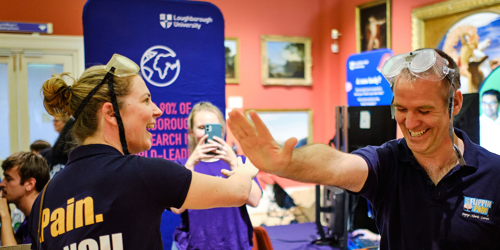 A visitor attempts one of the activities - and laughs as the mind-body illusion foxes him